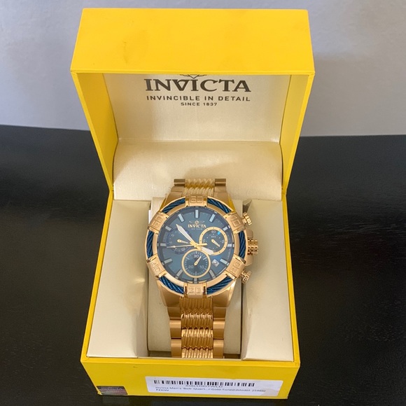 Mens Gold Invicta watch. Never been worn. Still has wrapping on band.